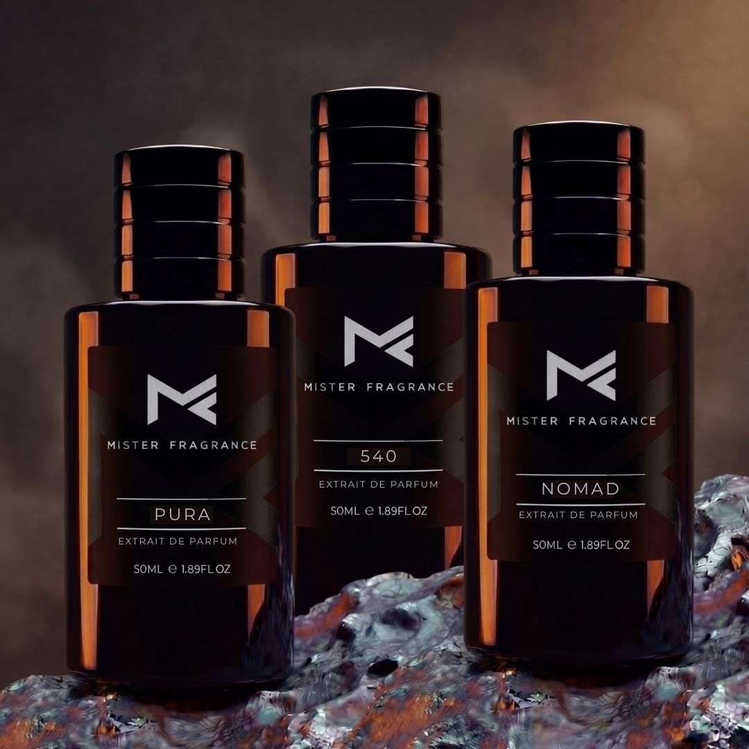 Set of three dark amber fragrance bottles with gold caps and black labels