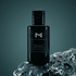 Dark glass perfume bottle with black cap and MISTERY label